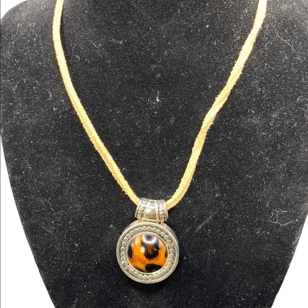 Leopard print silvertone pendant with beaded detail on tan sueded tied strap